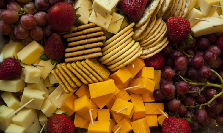 Aerial view of a fruit, cracker, and cheese platter