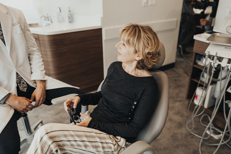 Patient talking to Dr. Perlman while in dentist's chair