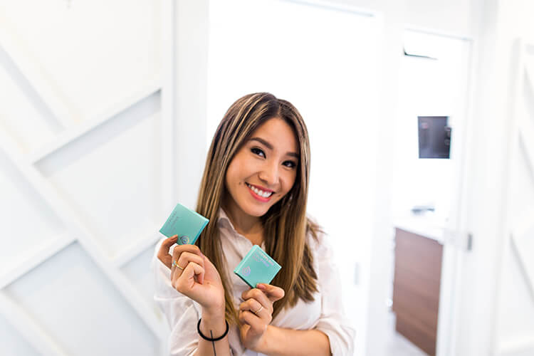 Dr. Mai holding floss