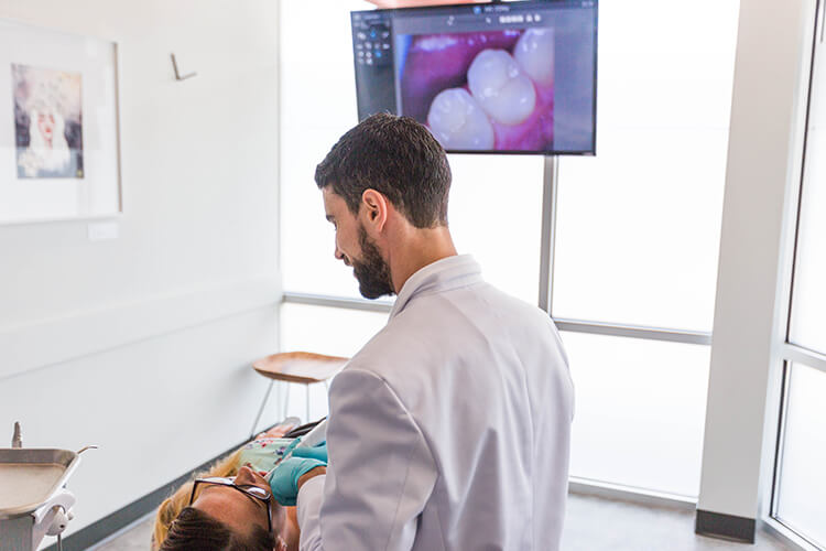 Woman in dentist chair receiving treatment