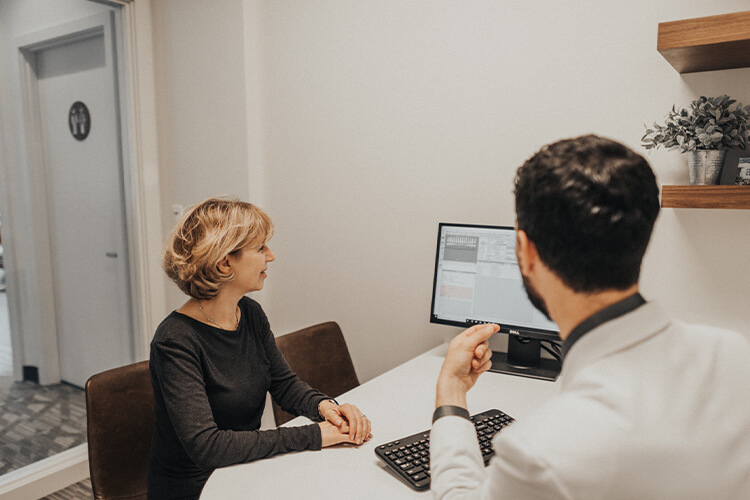 Dr Perlman and his patient reviewing information