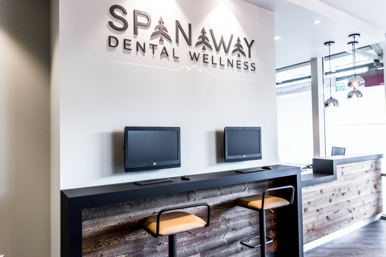 Spanaway Dental Office entry with computer screens and barstools